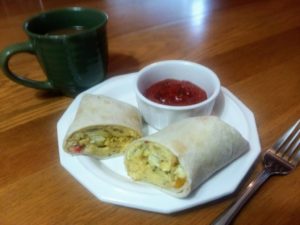 vegetarian breakfast burritos with dipping sauce and coffee
