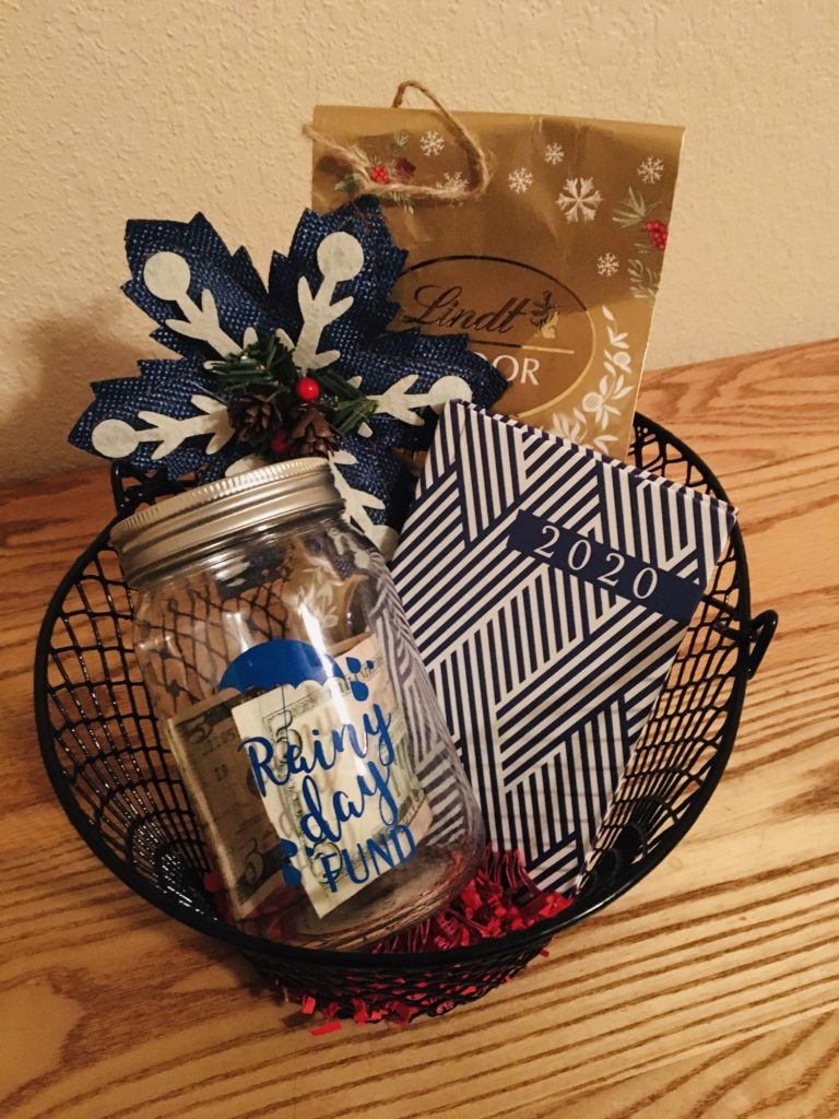 Rainy day fund themed gift basket with Bag of chocolates, rainy day fund jar with $5 starter fund, small planner and adorable ornament