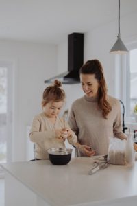 A mother practicing with baby steps to simple living by slowing down and enjoying time with her daughter